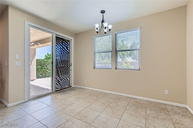 3605 Sapphire Sea Ct, North Las Vegas, NV 89031 - unfurnished dining area featuring a chandelier, baseboards, and light tile patterned floors