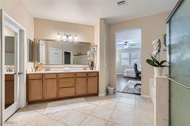 3605 Sapphire Sea Ct, North Las Vegas, NV 89031 - ensuite bathroom with double vanity, tile patterned floors, a shower with shower door, and a ceiling fan