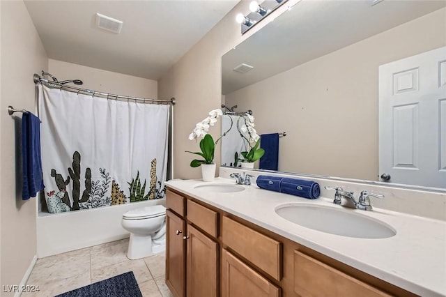 3605 Sapphire Sea Ct, North Las Vegas, NV 89031 - bathroom featuring toilet, double vanity, shower / bath combo with shower curtain, and tile patterned floors