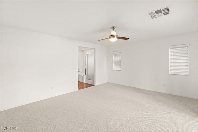 carpeted empty room with ceiling fan