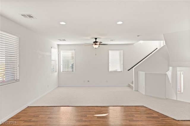 interior space with hardwood / wood-style flooring and ceiling fan