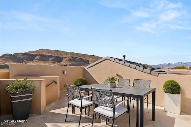 view of patio / terrace with a mountain view