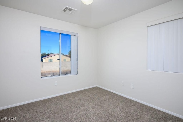 unfurnished room featuring carpet floors