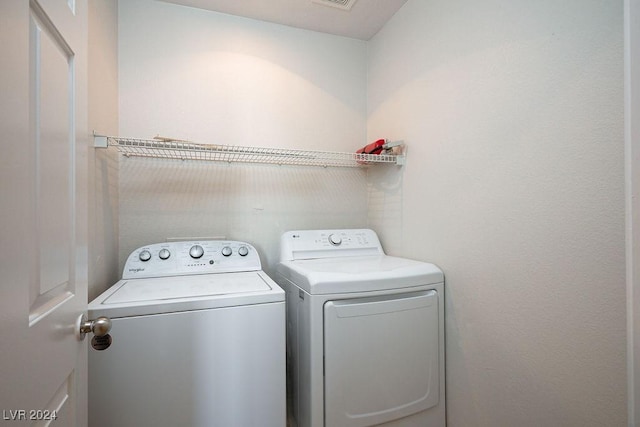 washroom with washer and clothes dryer