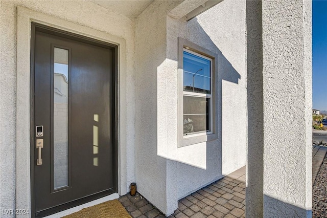 view of exterior entry featuring elevator