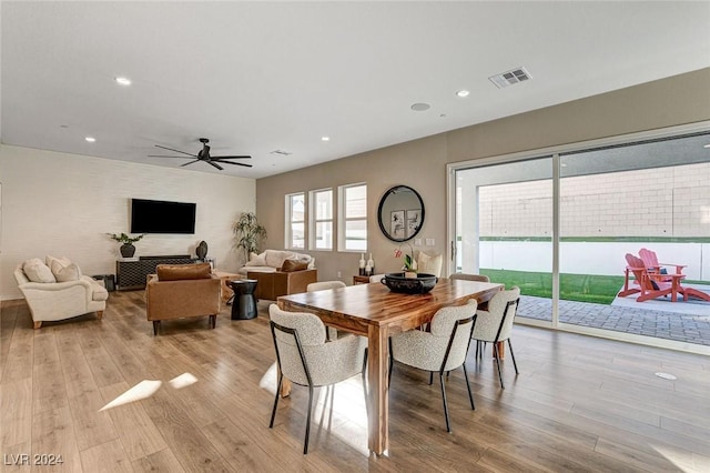 dining area featuring light wood-type flooring and ceiling fan