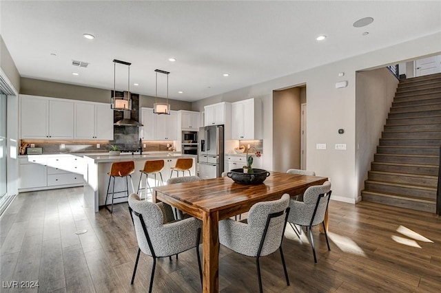 dining space featuring dark hardwood / wood-style floors