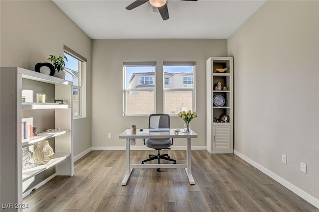 office with plenty of natural light, ceiling fan, and wood-type flooring