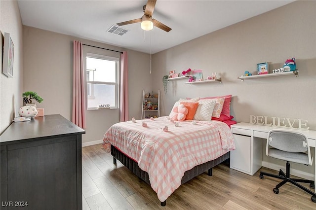 bedroom featuring ceiling fan and hardwood / wood-style flooring