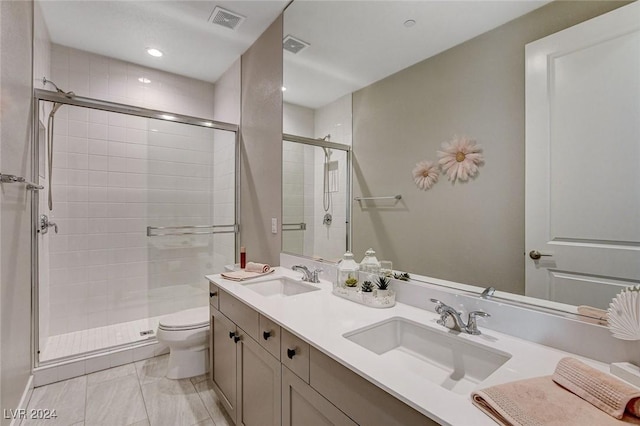 bathroom with vanity, toilet, and walk in shower