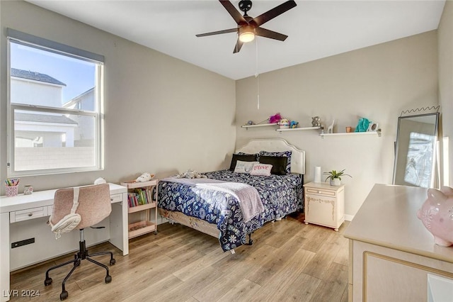 bedroom with light hardwood / wood-style flooring and ceiling fan