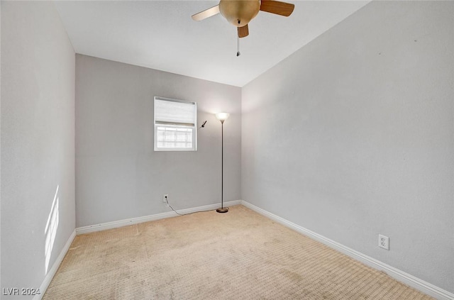 unfurnished room featuring ceiling fan and light colored carpet