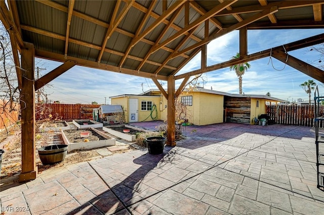 view of patio with a gazebo and an outdoor structure