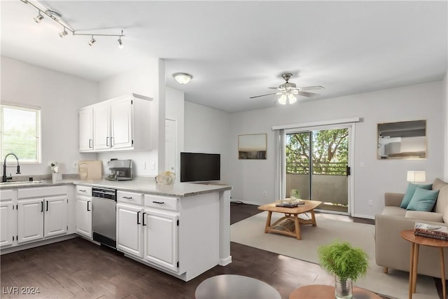 kitchen with dark hardwood / wood-style flooring, ceiling fan, sink, dishwasher, and white cabinetry