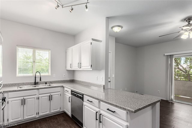 kitchen with kitchen peninsula, white cabinetry, sink, and dishwasher