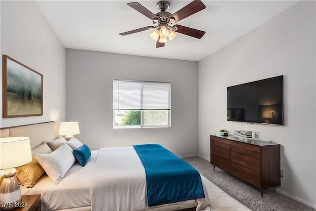 bedroom featuring ceiling fan and light colored carpet