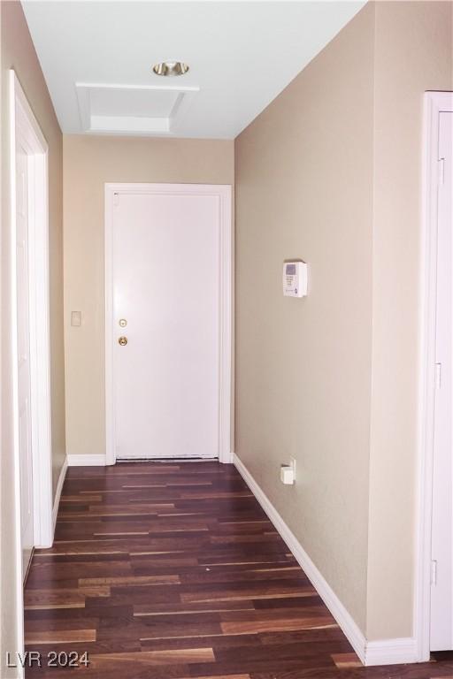 corridor featuring dark hardwood / wood-style flooring