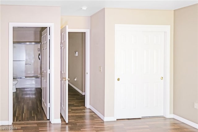 hallway with wood-type flooring