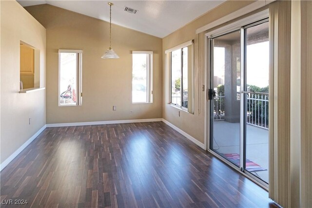 interior space with dark hardwood / wood-style floors and vaulted ceiling