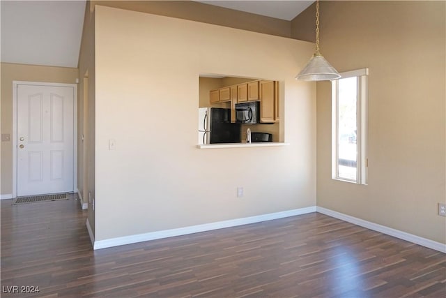 interior space with dark hardwood / wood-style flooring and high vaulted ceiling