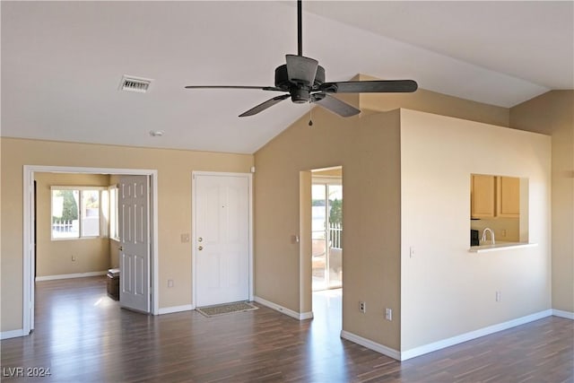 spare room with dark hardwood / wood-style floors, ceiling fan, and lofted ceiling