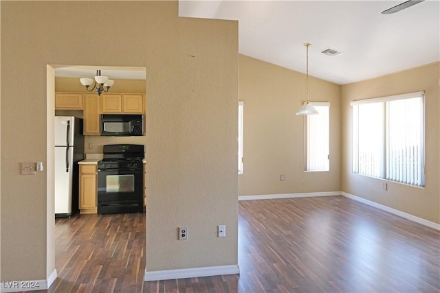 kitchen featuring black appliances, decorative light fixtures, vaulted ceiling, a notable chandelier, and dark hardwood / wood-style flooring