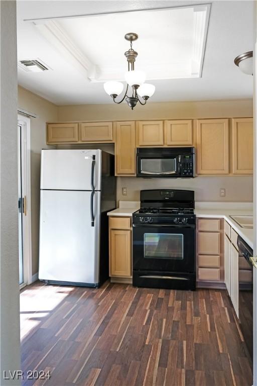 kitchen featuring light brown cabinets, a raised ceiling, dark hardwood / wood-style floors, a chandelier, and black appliances