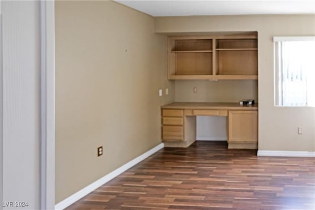 unfurnished office featuring dark hardwood / wood-style floors