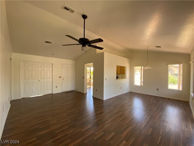 unfurnished living room with visible vents, ceiling fan, dark wood-style flooring, and lofted ceiling