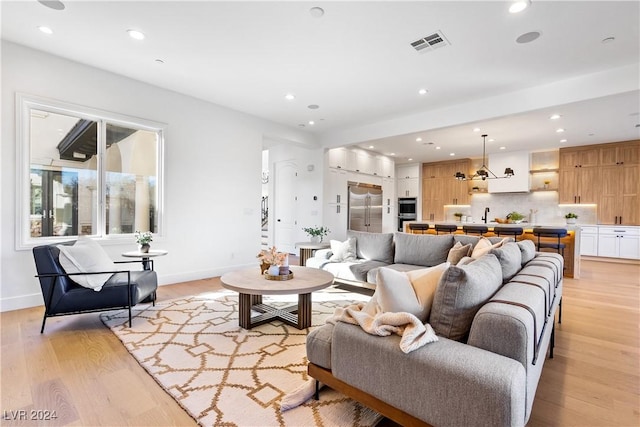 living room with light hardwood / wood-style flooring