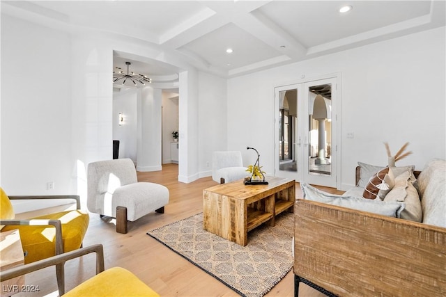 living area with hardwood / wood-style floors, french doors, coffered ceiling, and beam ceiling