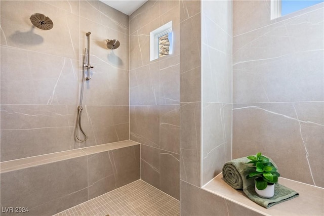 bathroom with a tile shower