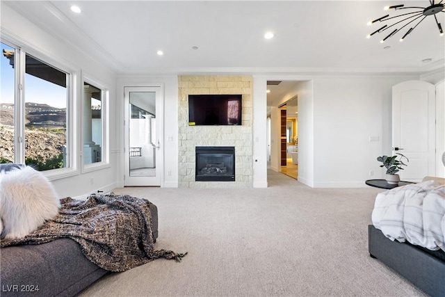 bedroom featuring crown molding, access to outside, a fireplace, and light carpet