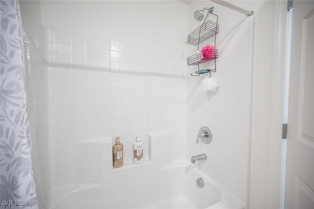 bathroom featuring shower / tub combo with curtain