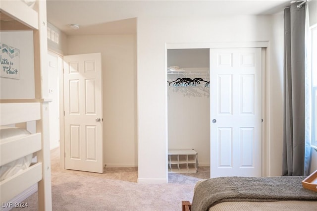 carpeted bedroom with a closet