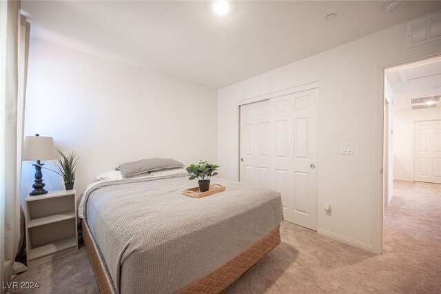 carpeted bedroom featuring a closet