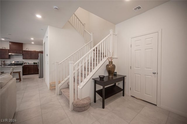 staircase with tile patterned flooring