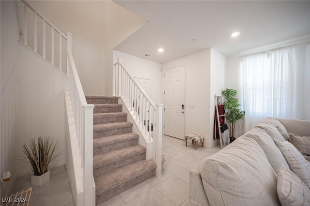 stairs with tile patterned floors