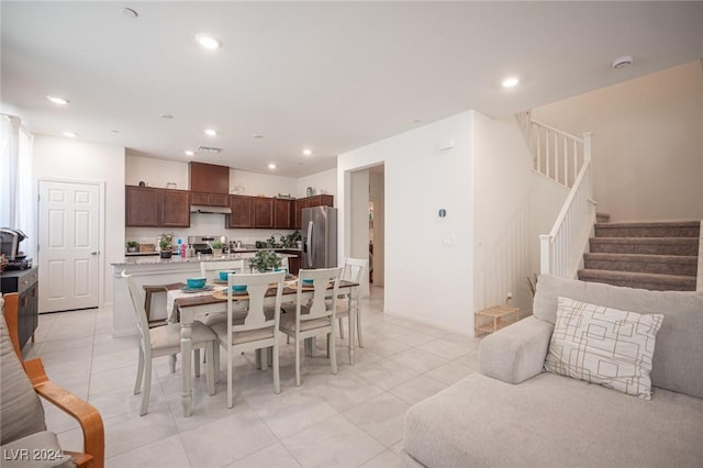 dining space featuring light tile patterned floors