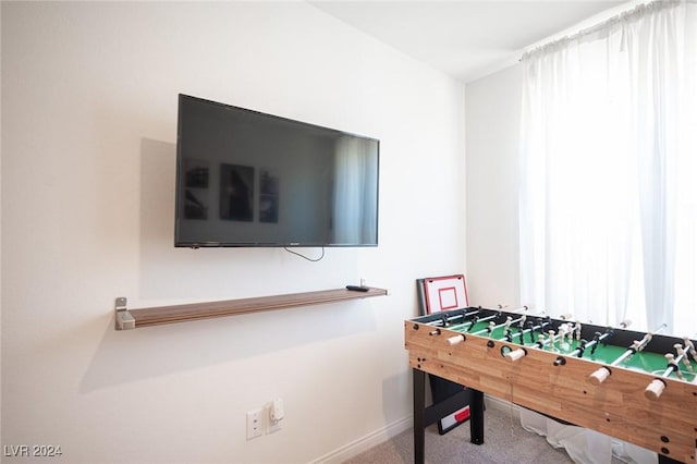 game room featuring carpet and a healthy amount of sunlight