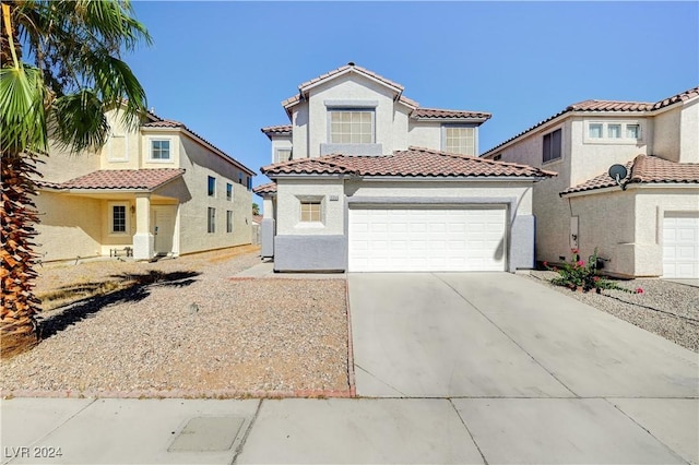 mediterranean / spanish-style house featuring a garage