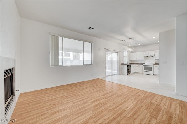 unfurnished living room with light wood-type flooring