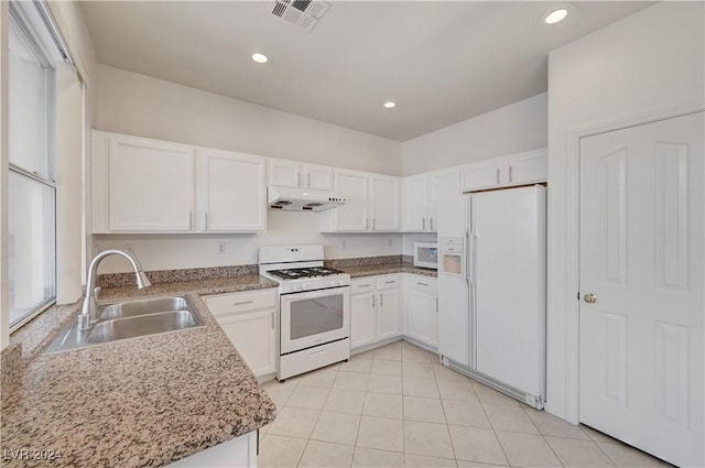 kitchen with sink, white appliances, white cabinets, and range hood