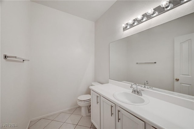 bathroom featuring tile patterned flooring, vanity, and toilet