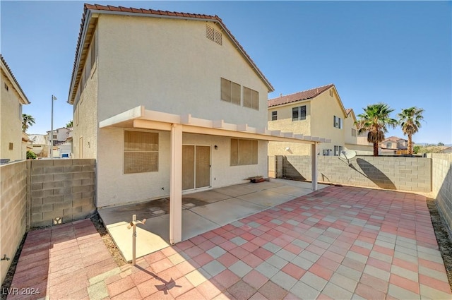 back of house with a patio area