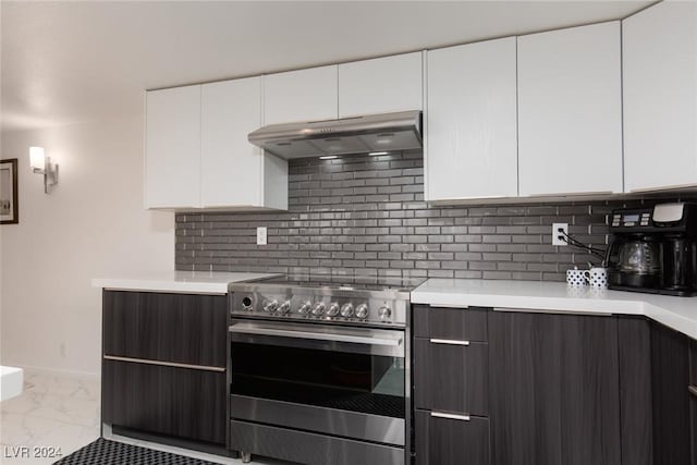 kitchen featuring electric range, decorative backsplash, white cabinets, and dark brown cabinetry