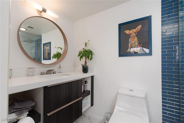 bathroom with vanity and toilet