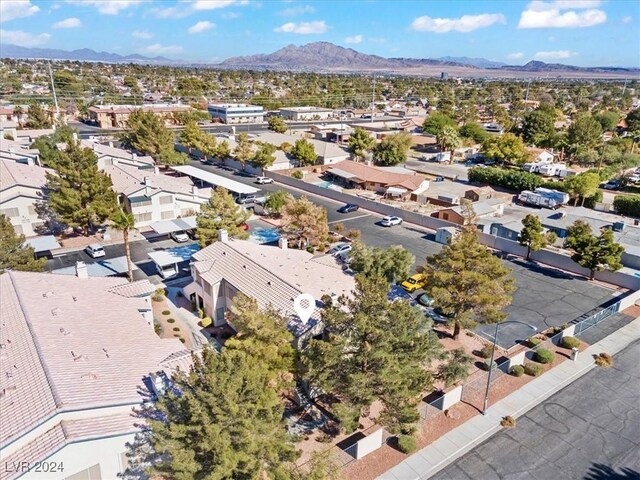 birds eye view of property with a mountain view