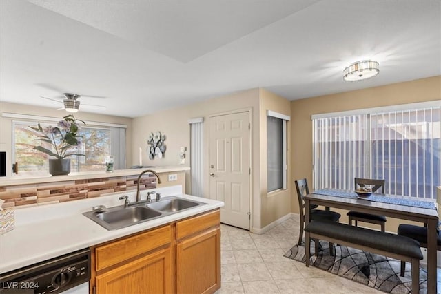 kitchen with dishwasher, sink, ceiling fan, and light tile patterned floors