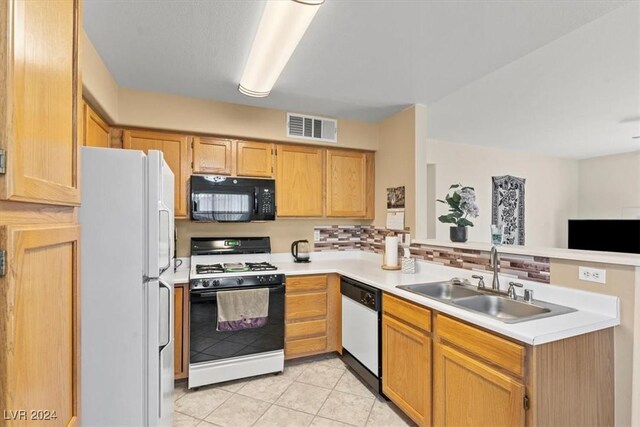 kitchen featuring light tile patterned flooring, white appliances, backsplash, and sink